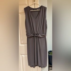 Never worn! Soft, flattering, gray. Dress up for a party or a business meeting!